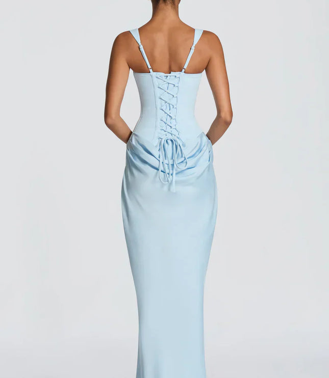 Back view of pale yellow corset maxi dress with lace-up closure and gathered skirt
