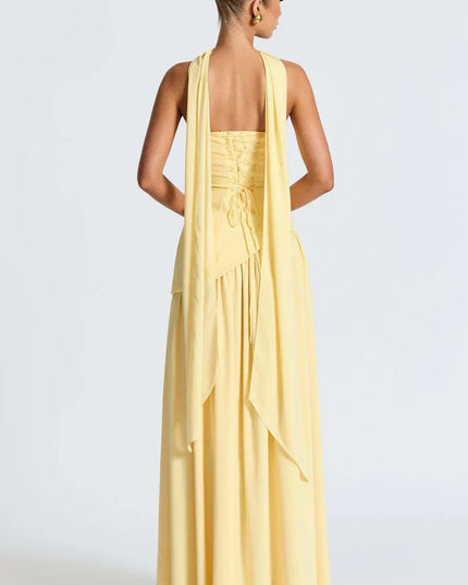 Pale yellow halter maxi dress with long back scarf detail and open back view