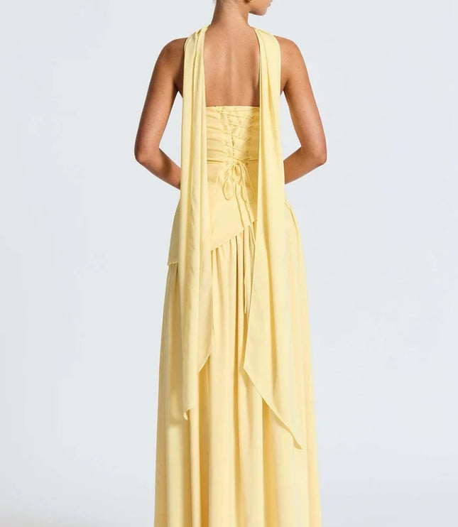 Pale yellow halter maxi dress with long back scarf detail and open back view