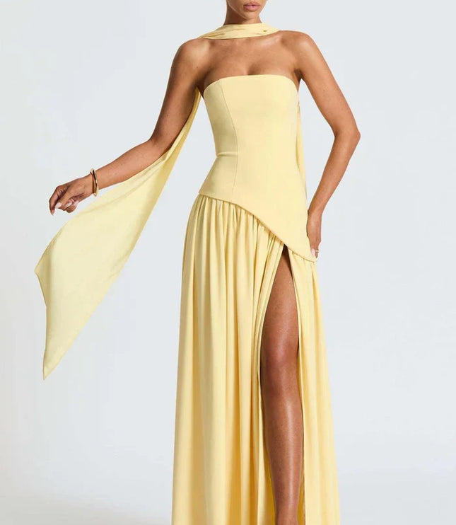 Pale yellow halter maxi dress with scarf tie, strapless bodice, and thigh slit front view