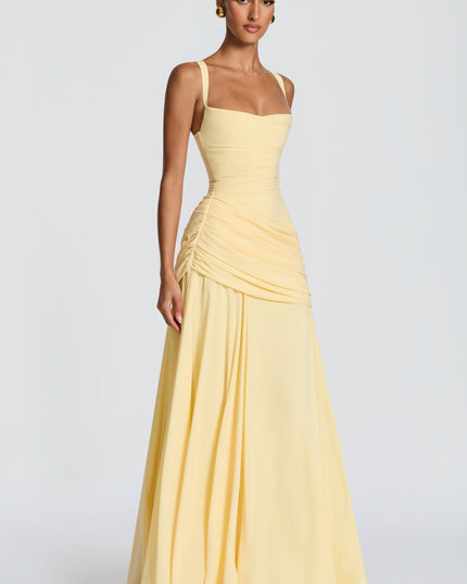Pale yellow square neck satin maxi dress with fitted bodice and soft draped skirt, angled front view