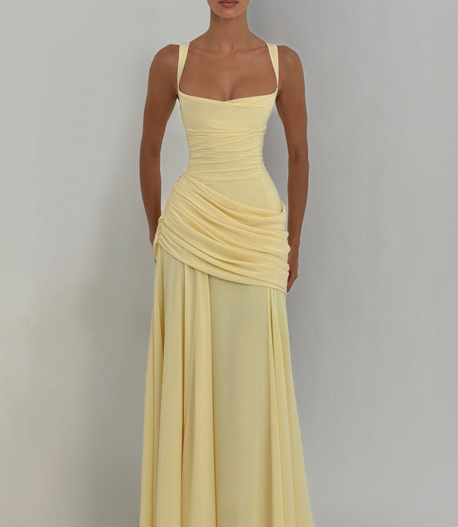 Close-up of pale yellow satin maxi dress bodice with square neck, wide straps, and ruched waist
