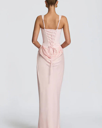 Soft pink corset maxi dress back view with lace-up detail and long skirt