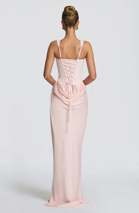 Soft pink corset maxi dress back view with lace-up detail and long skirt