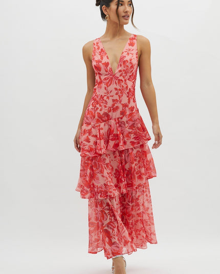 Pink floral ruffled maxi dress angled side view showing tiered hem and v-neck bodice
