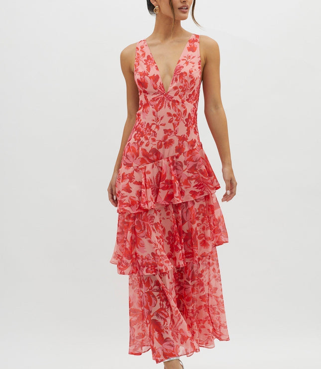 Pink floral ruffled maxi dress angled side view showing tiered hem and v-neck bodice