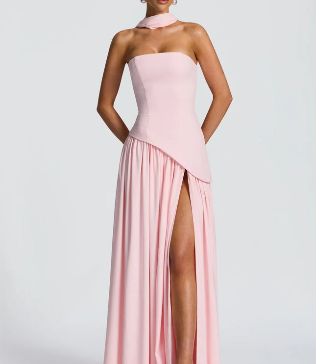 Pink halter maxi dress with strapless bodice and high slit, front view