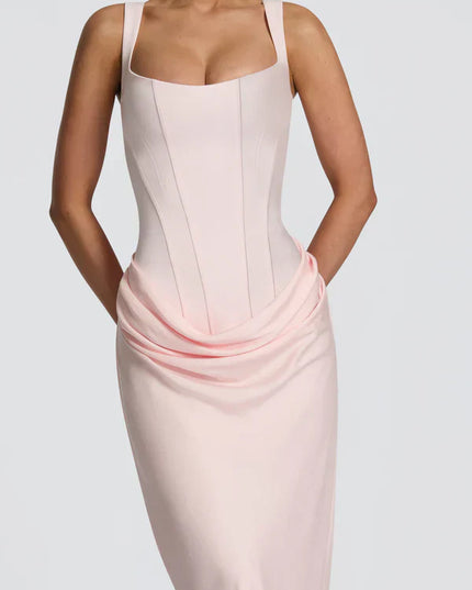 Closeup of pale pink square neck corset maxi dress with draped waist