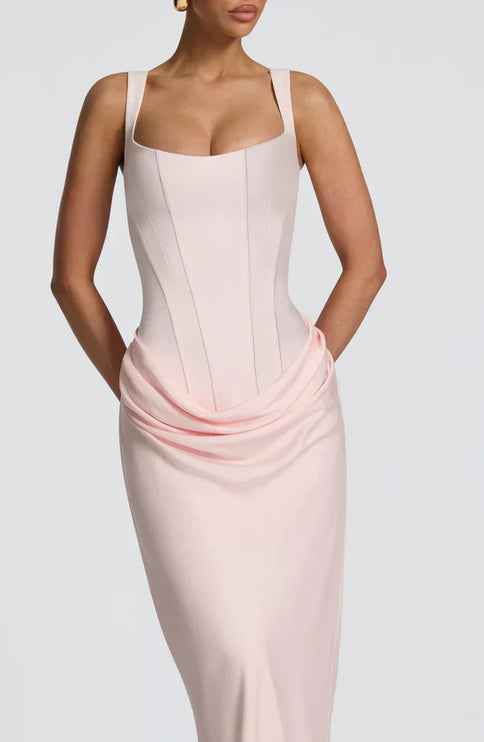 Closeup of pale pink square neck corset maxi dress with draped waist