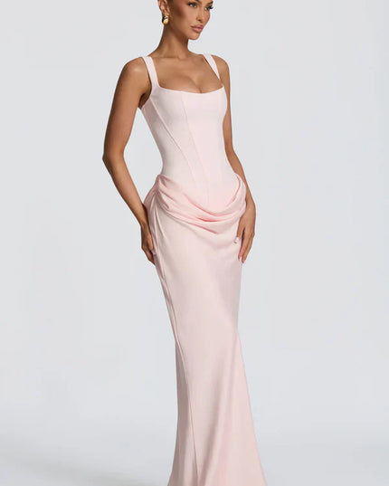 Pink square neck corset maxi dress in side angle with flowing hem
