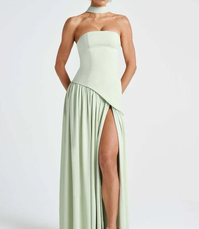 Sage green halter maxi dress showing the strapless bodice and high slit from the front