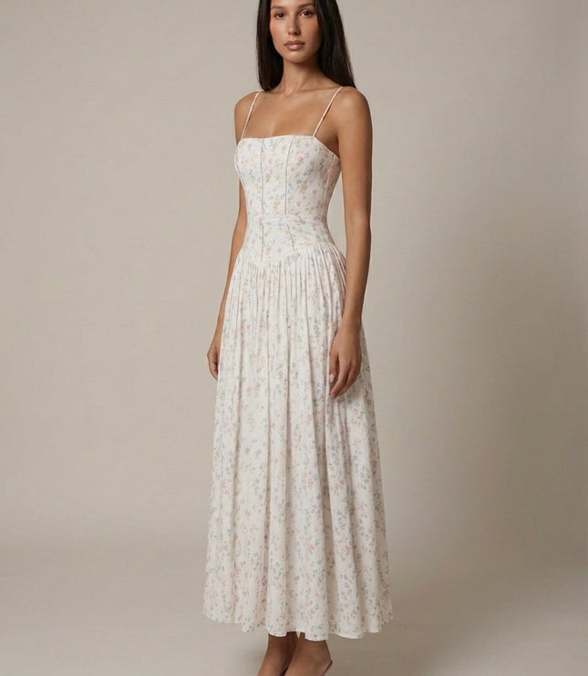 White ditsy floral corset midi dress with fitted bodice and full skirt, angled front view