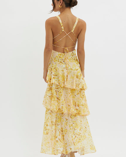 Yellow floral ruffled maxi dress back view with open back and crisscross tie straps