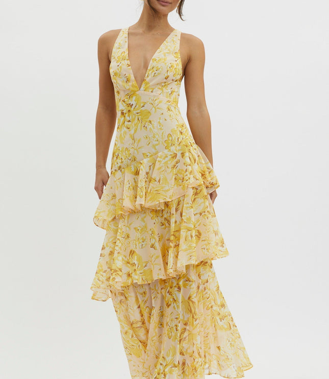 Yellow floral ruffled maxi dress angled view highlighting cascading tiered skirt and v-neck