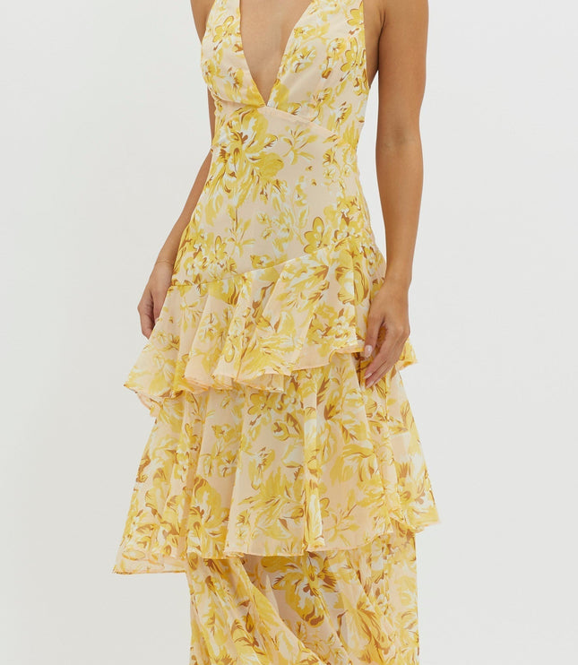 Closeup of yellow floral maxi dress bodice with deep v-neckline and ruffled tier detail